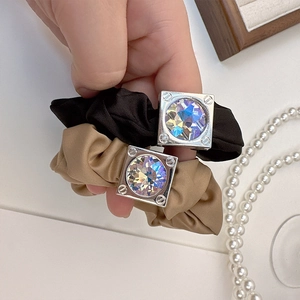 Elegant satin hair ties in black and champagne gold with square crystal metal charms