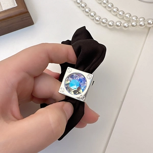 Elegant black satin hair scrunchie with a square silver buckle and iridescent crystal