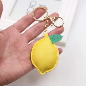 Realistic yellow lemon PU leather keychain with green leaf and golden metal clasp