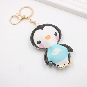 Porte-clés pingouin mignon en cuir PU avec fermoir doré et motif de petit poisson