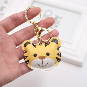 Handheld cute yellow tiger PU leather keychain with gold hardware and contrast stitching