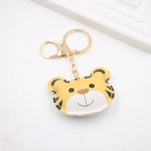 Cute yellow tiger PU leather keychain with gold lobster clasp and white stitching detail