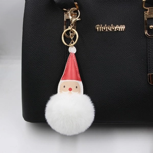 Porte-clés Père Noël en pompon mignon avec bonnet rouge et fermoir doré sur sac
