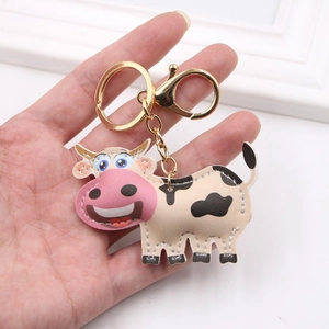 Cute cartoon cow leather keychain with golden clasp for bags and accessories