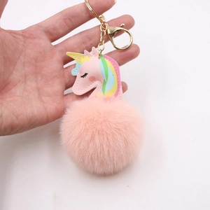 Pink unicorn pompom keychain with colorful mane and gold lobster clasp for girls