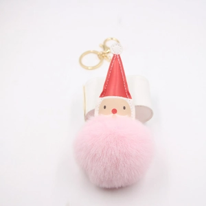 Porte-clés Père Noël en peluche rose avec bonnet rouge et fermoir doré élégant