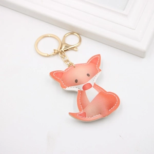 Süßer orangefarbener Fuchs-Schlüsselanhänger aus Kunstleder mit goldenem Ring und Herz