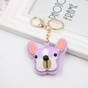 Close-up of a purple PU leather French Bulldog keychain with gold lobster clasp and ring