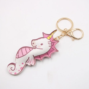 Portachiavi a forma di ippocampo unicorno in pelle PU rosa e bianca con anello dorato