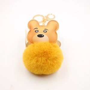 Cute cartoon tiger faux fur ball keychain with yellow plush pompom and gold hardware