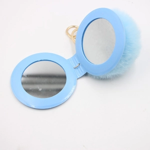 Light blue double-sided folding makeup mirror keychain with soft faux fur pompom and gold ring