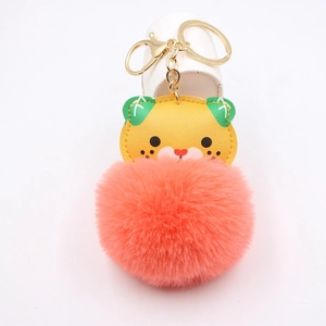 Cartoon tiger plush keychain with pink faux fur pompom and golden lobster clasp hardware