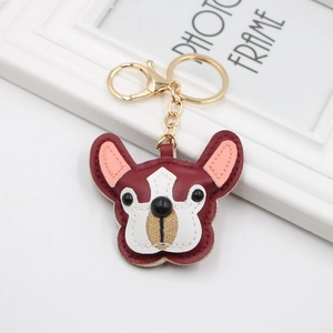 Detail view of burgundy PU leather French Bulldog keychain with gold lobster clasp