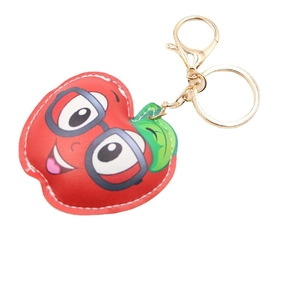 Cartoon red leather apple keychain with golden clasp and stitched details for bags