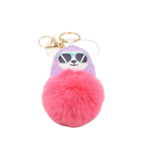 Stylish faux fur pompom keychain with purple cartoon head and gold ring for handbags