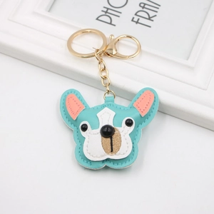 Detail of light blue PU leather French Bulldog keychain with gold metal clasp and ring
