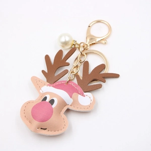 Christmas reindeer leather keychain with pearl accent and gold metal clasp for bags