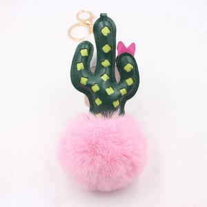 Green leather cactus keychain with large pink faux fur pompom and golden lobster clasp