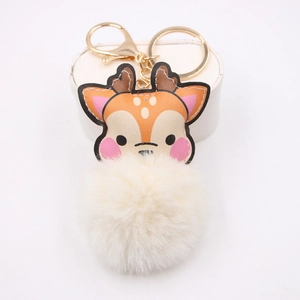 Detail view of a cute deer plush ball keychain with golden metal clasp for bags