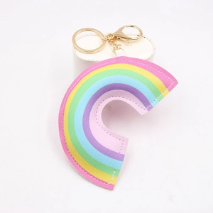 Rainbow faux leather keychain with gold lobster clasp and colorful striped padded design