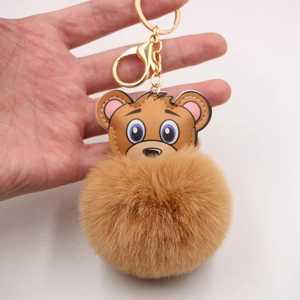 Porte-clés mignon avec pompon en fourrure d'ours en cuir marron et anneau doré chic