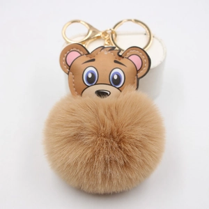 Porte-clés pompon en peluche marron avec tête d'ours en cuir et fermoir doré élégant