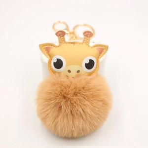 Porte-clés girafe en cuir jaune avec grand pompon marron doux et fermoir doré