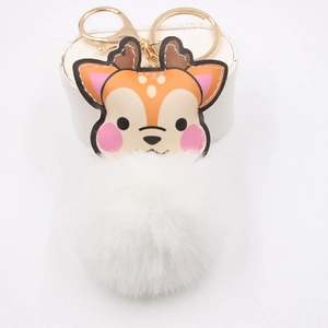 Detailed close-up of cartoon deer leather charm with a large fluffy white pompom and gold clasp
