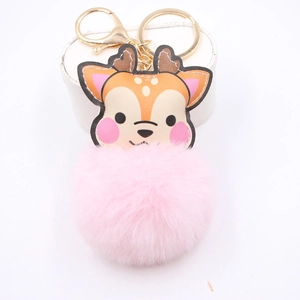 Cute reindeer keychain with a pink plush pom pom and golden metal clip for bags