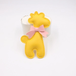 Cute yellow giraffe PU leather charm accessory with pink bow and cross pattern texture