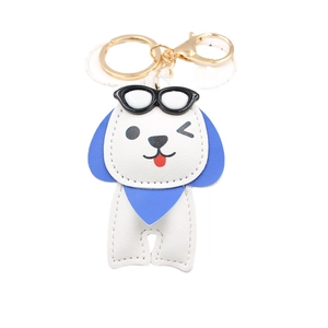 Porte-clés chien mignon avec lunettes de soleil en cuir PU et boucle métallique dorée