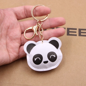 Cute panda leather 3D keychain held by hand featuring black and white stitched details