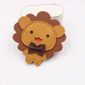 Handcrafted leather lion phone wristband accessory with decorative bow and premium stitching