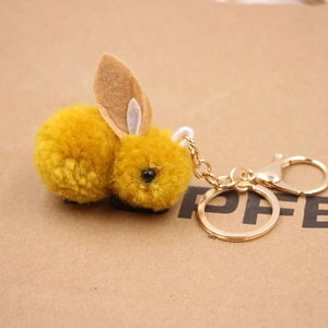 Porte-clés lapin en peluche jaune avec pompons doux et fermoir en métal doré
