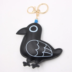 Cute black leather bird keychain with blue embroidery and gold lobster clasp