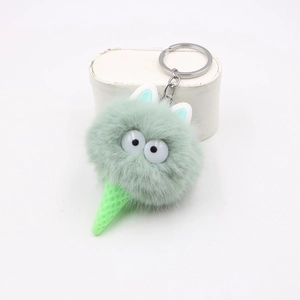Portachiavi peluche elfo cono verde menta con grandi occhi su piedistallo bianco