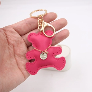 Fuchsia leather bear keychain with gold Love & Wish charm and lobster clasp for bags