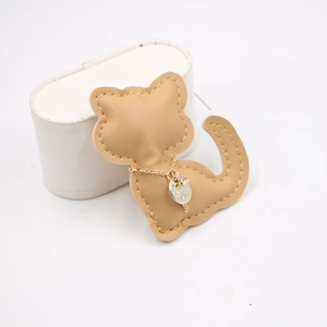 Cute handmade camel leather cat bag charm with gold chain and clear crystal accent