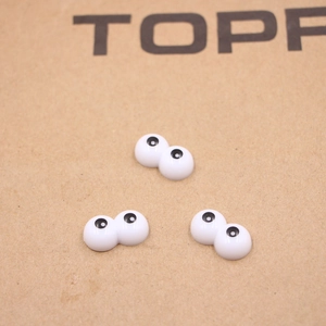 DIY cartoon resin eyes for doll making and creative crafts on neutral background