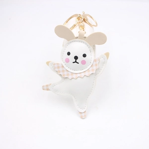 Close-up of ballet rabbit leather keychain with plaid collar and gold hardware