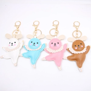 Detail view of four ballet bunny leather keychains in white blue pink and brown colors