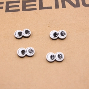 Detailed view of DIY resin cartoon googly eyes with assorted pupil directions for crafts