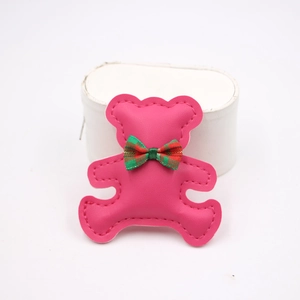 Cute magenta bear phone case charm with green plaid bow and faux leather texture