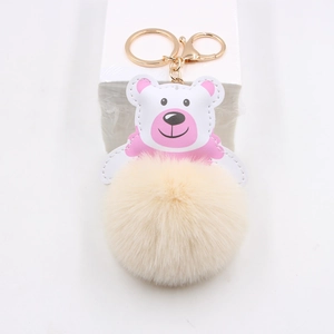 Cute pink and white PU leather bear head keychain with a large fluffy beige faux fur pompom