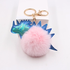 Porte-clés dinosaure en peluche rose avec épines bleues brillantes et mousqueton doré