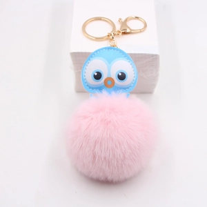 Cute leather owl keychain with a large pink pompom and golden lobster clasp