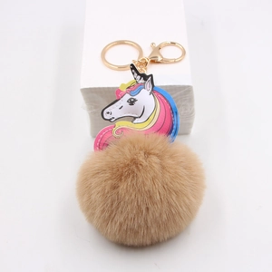 Colorful unicorn keychain featuring a soft camel faux fur pompom and gold lobster clasp