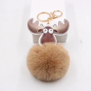 Porte-clés pompon en peluche élan marron avec fermoir doré et charme bois de cerf