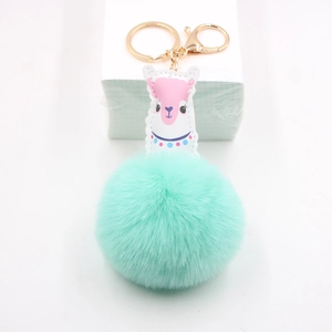 Porte-clés alpaga vert menthe avec pompon en fausse fourrure et fermoir doré