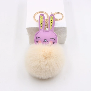 Cute purple bunny leather head with cream fur ball keychain and golden metal clasp